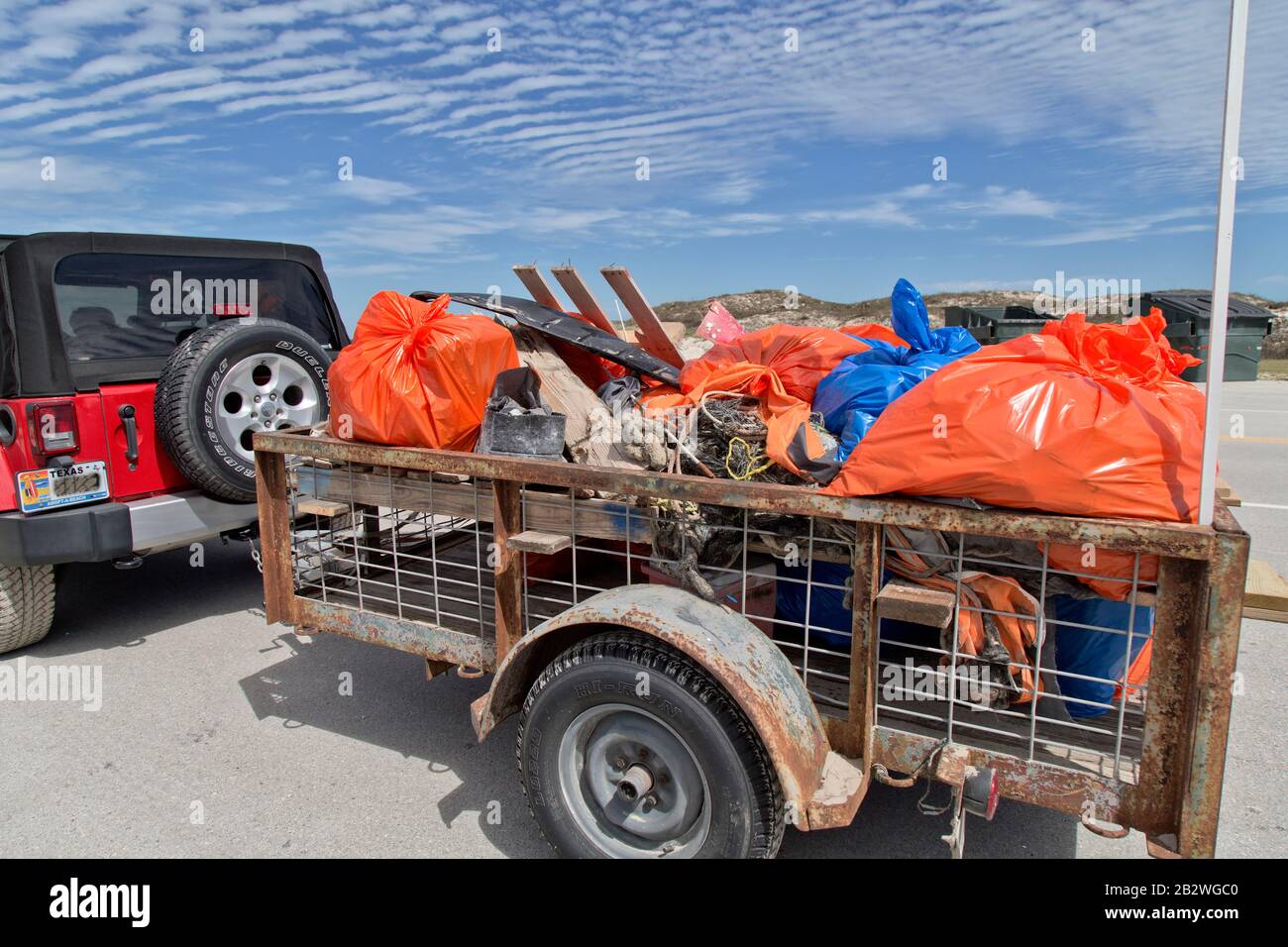 Volunteers trailer containing marine debris & coastal trash collected Big Shell Beach cleanup. Stock Photo