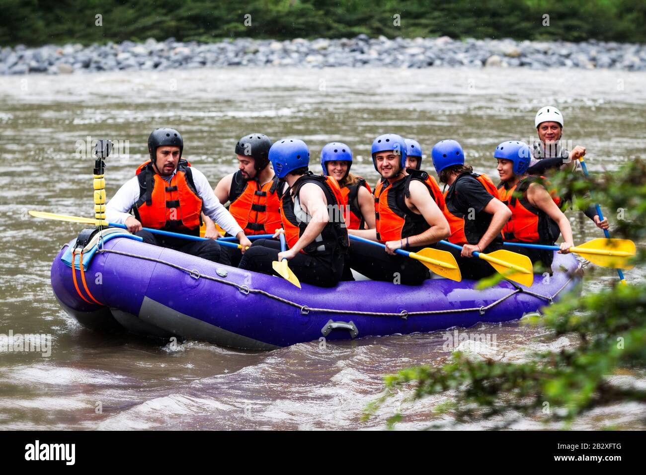 Group Of Tourists Getting Ready For A Whitewater Rafting Trip On ...