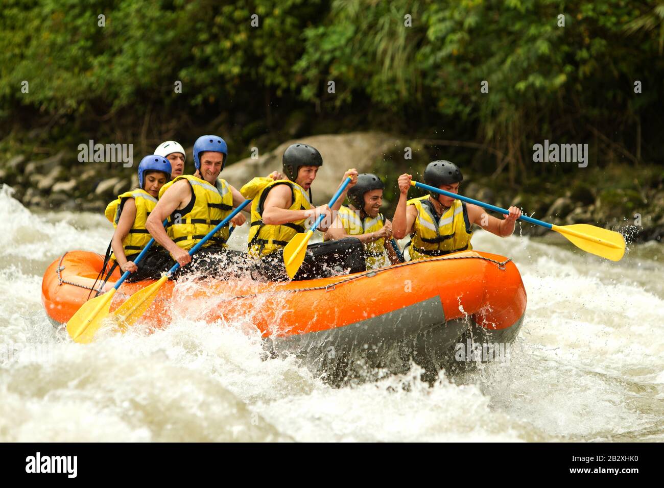 Union Of Mixed Pioneer Men And Lady With Guided By Specialist Pilot On Whitewater River Rafting In Ecuador Stock Photo