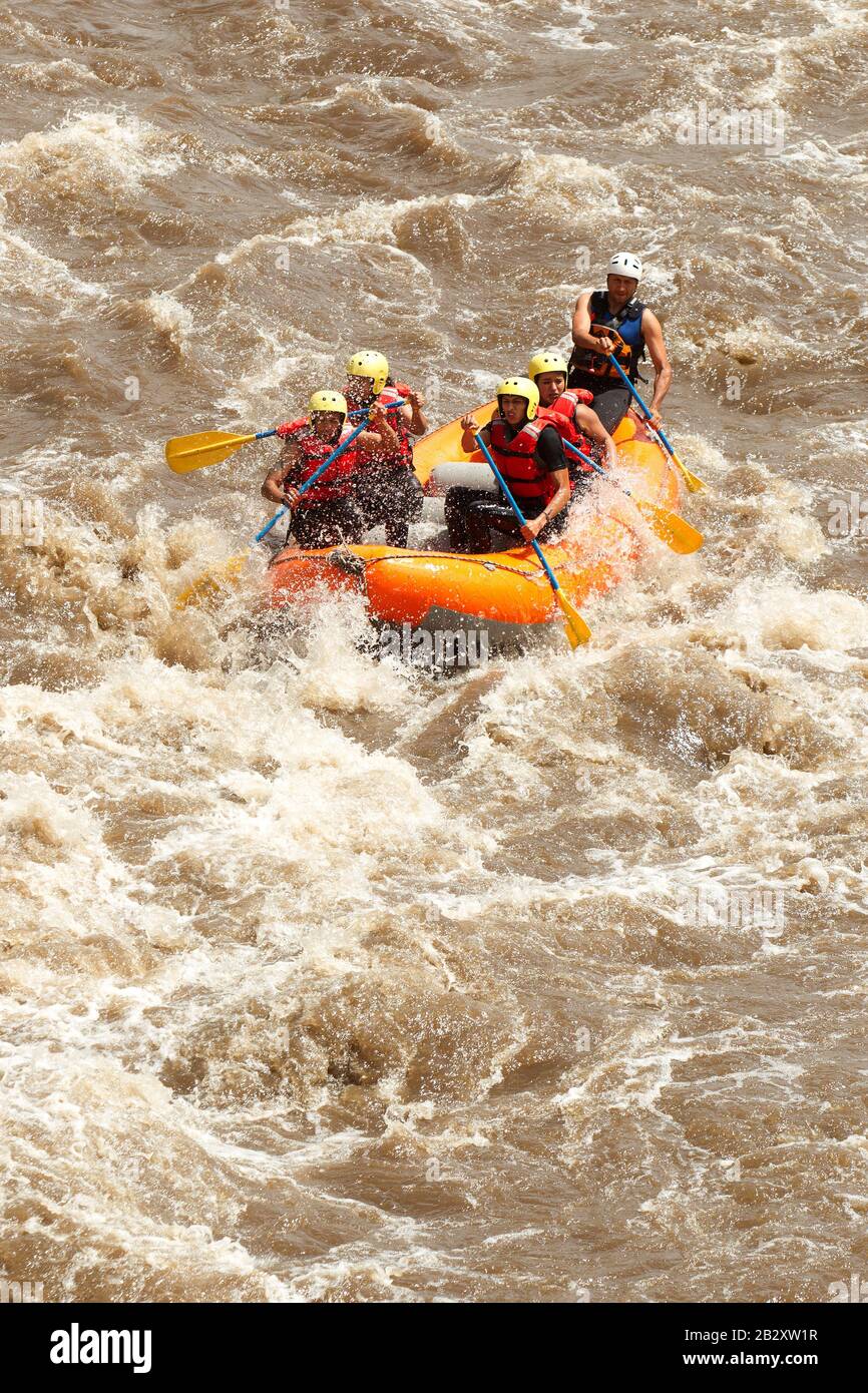 Gathering Of Mixed Pilgrim Male And Women With Guided By Professional Pilot On Whitewater Creek Rafting In Ecuador Stock Photo