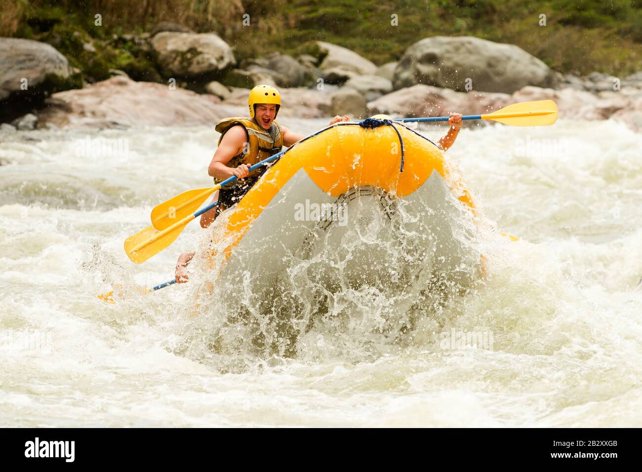 Partnership Of Mixed Visitor Human And Femininity With Guided By Professional Pilot On Whitewater Waterway Rafting In Ecuador Stock Photo