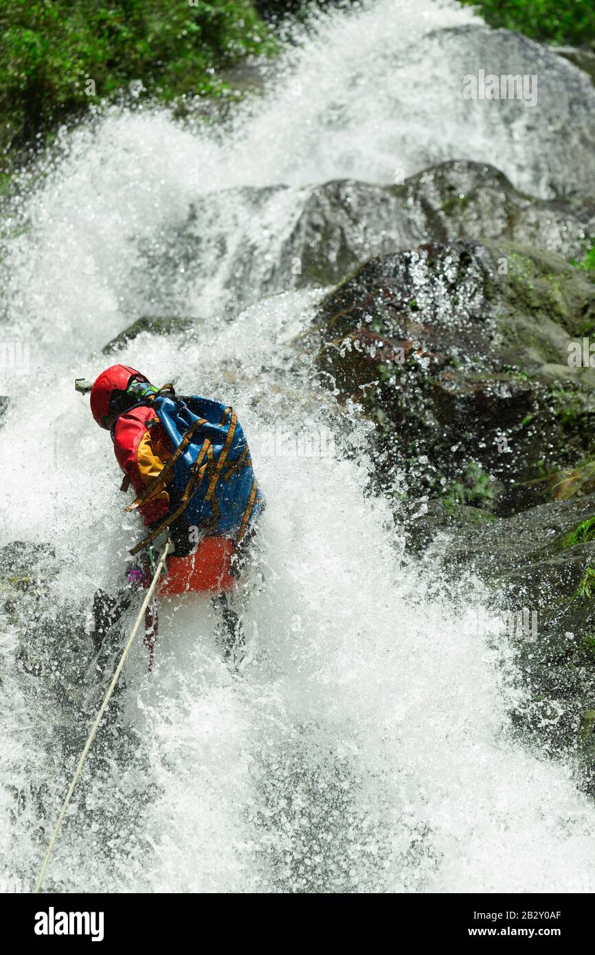 Waterfall Descent By A Professional Canyoning Instructor Stock Photo