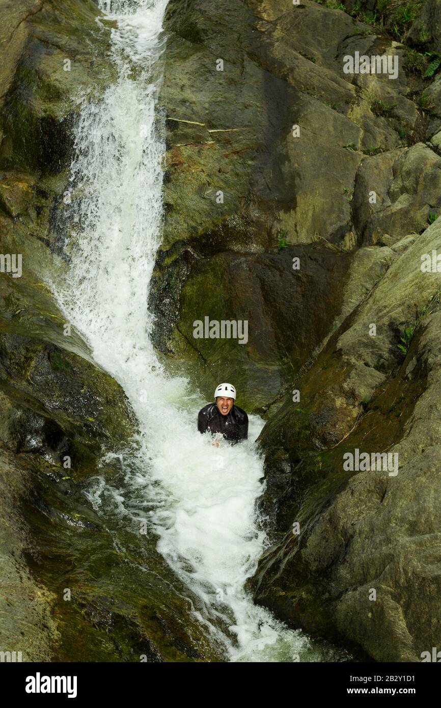 Canyoning Lead Trying Out A New Route In Chama Waterfall Banos De Agua Santa Ecuador Stock Photo