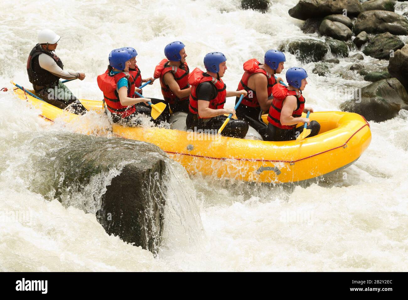 Partnership Of Mixed Pilgrim Men And Femininity With Guided By Professional Pilot On Whitewater River Rafting In Ecuador Stock Photo