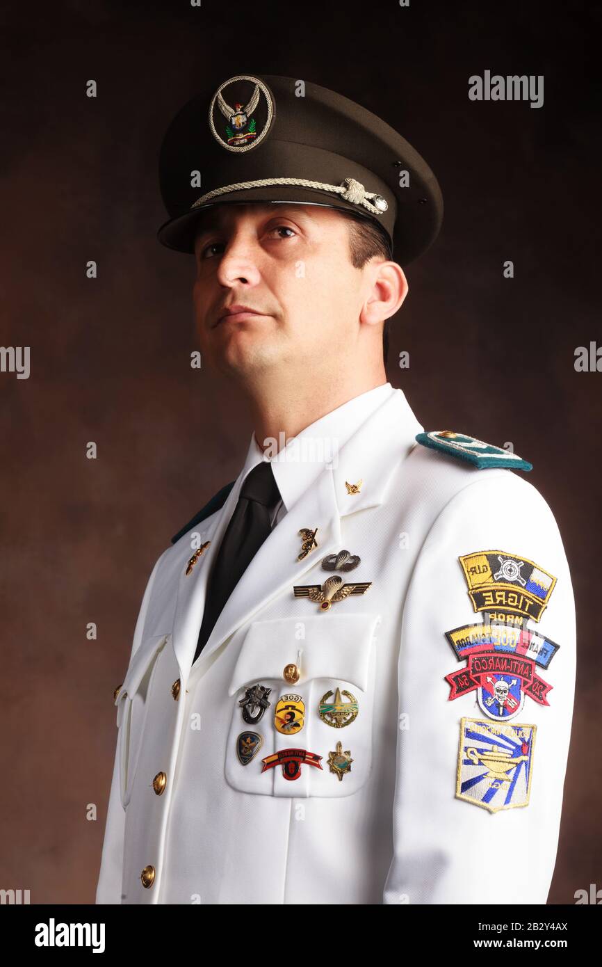 Highly Decorated Ecuadorian Police Official Dressed Up In Formal Uniform Studio Shot Stock Photo