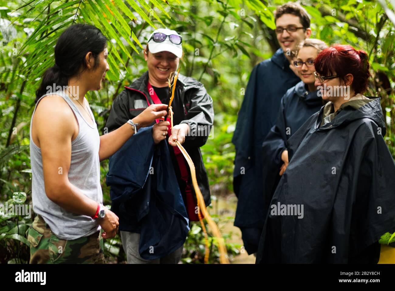 Naturalist Local Leader With Group Of Mountaineer In Cuyabeno Fauna Preserve Ecuador Stock Photo