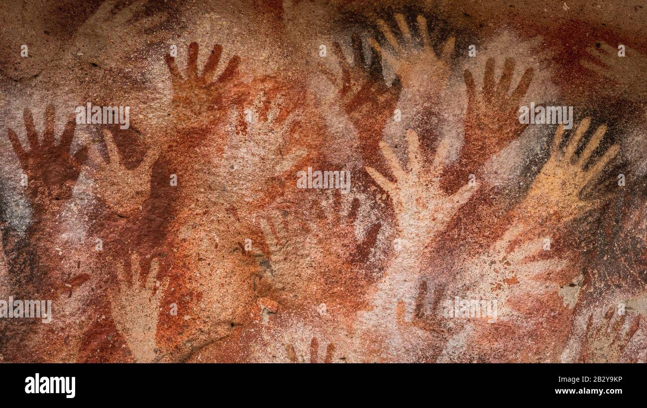 Prehistoric cave paintings at the Cave of Hands (Spanish: Cueva de Las Manos ) in Santa Cruz Province, Patagonia Argentina, South America. Stock Photo