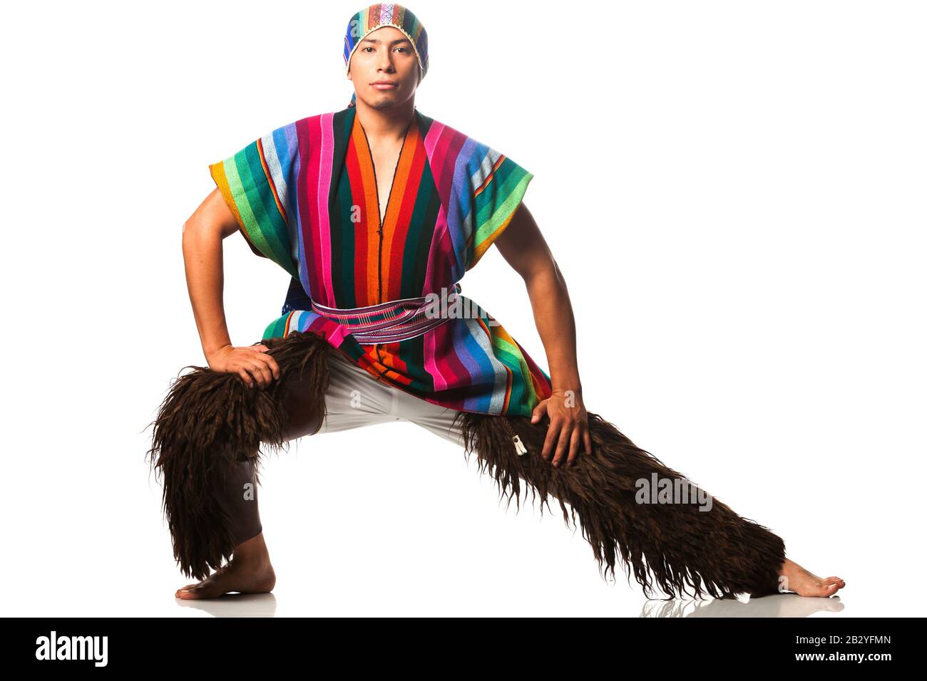 Capture the vibrant essence of Ecuadorian culture with a stunning studio shot of a traditional highlands dancer,adorned in a captivating costume featu Stock Photo