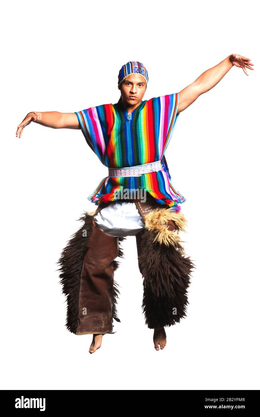 Experience the vibrant culture of Ecuador through a stunning studio shot of a traditional Andean dancer dressed in colorful clothing,performing a jump Stock Photo