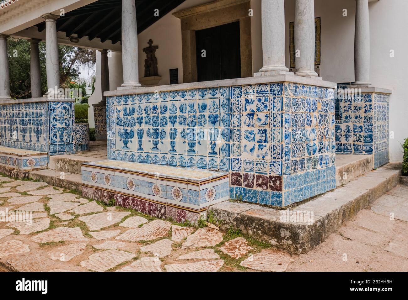 blue and white portuguese tiles used on the exterior of a building