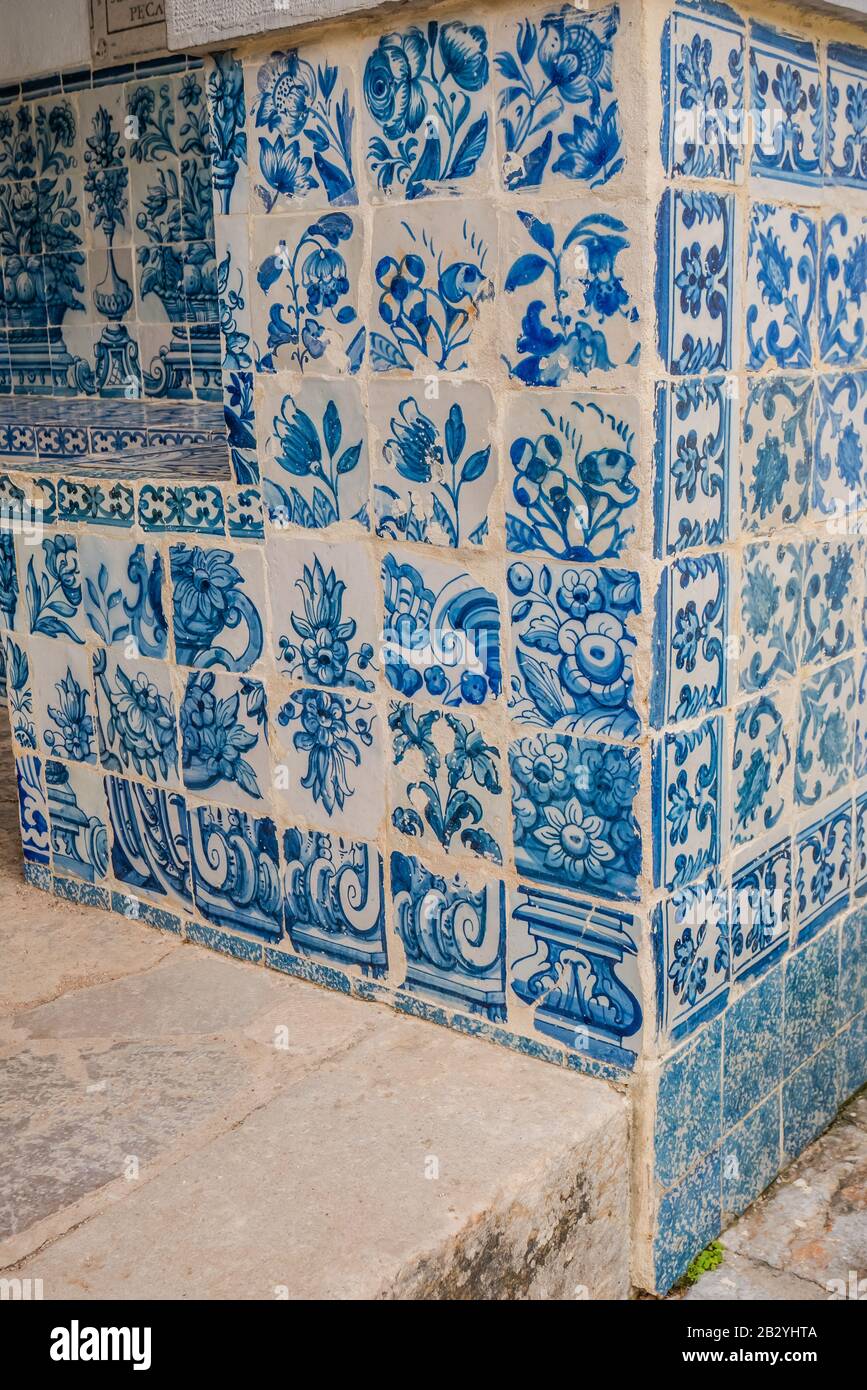 blue and white portuguese tiles used on the exterior of a building