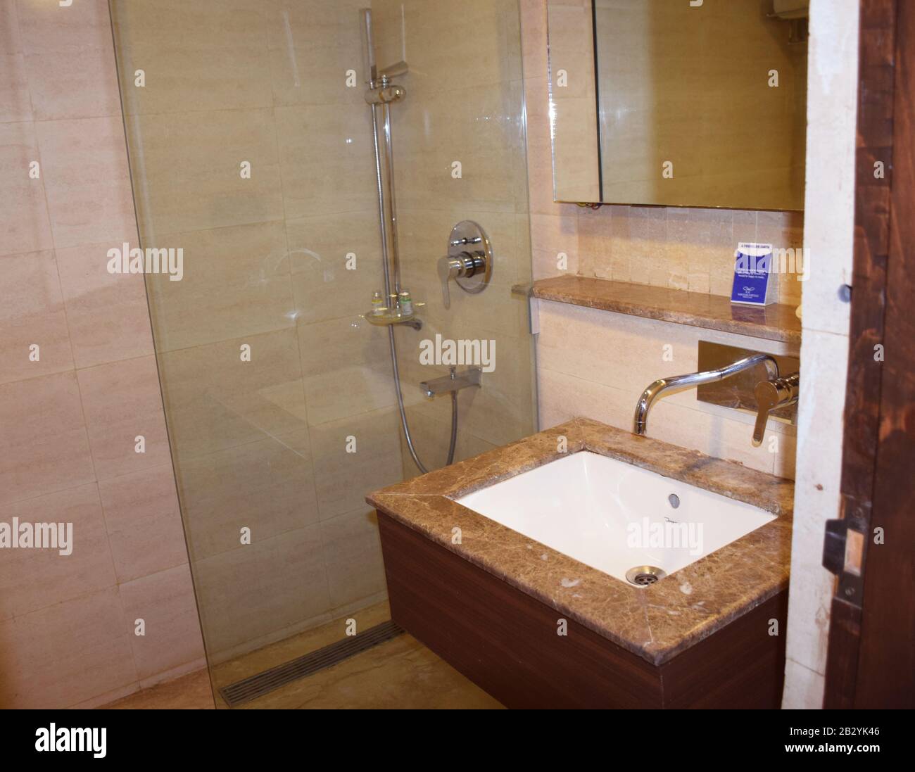 Attached restroom or washroom of a hotel room in India. Indian hotel loo Stock Photo