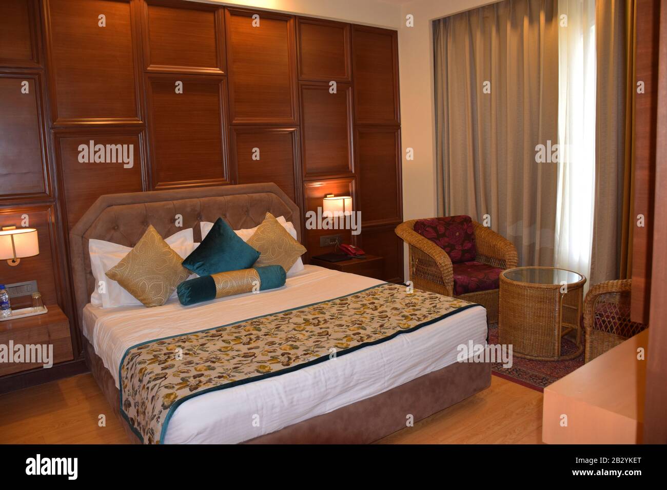 A luxurious comfortable hotel bedroom - Hotel room - Indian Hotel room Stock Photo
