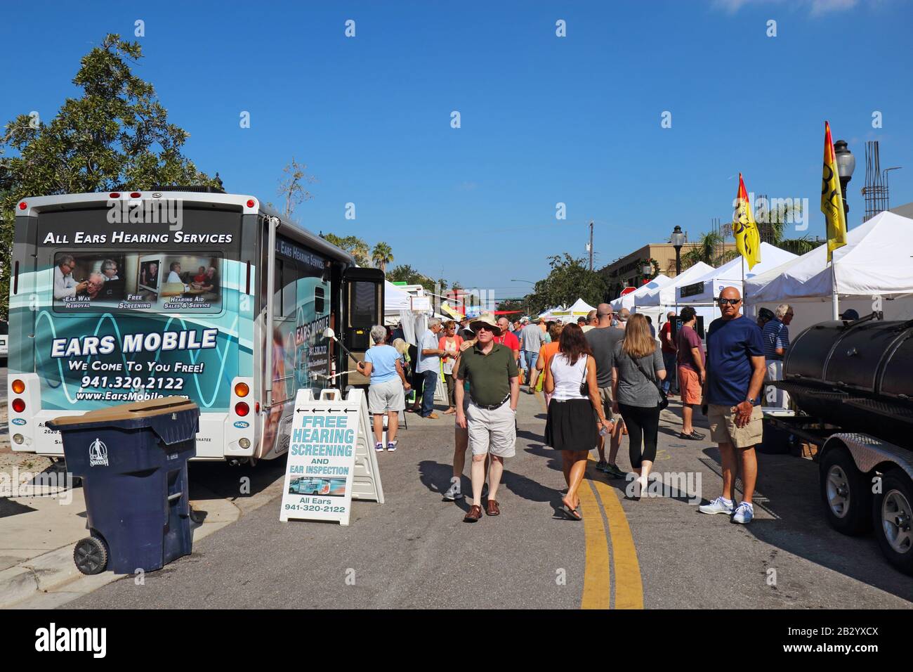 Vendors and shoppers at the Sarasota Farmers Market in fall. This vibrant event occurs downtown on Lemon Avenue Stock Photo