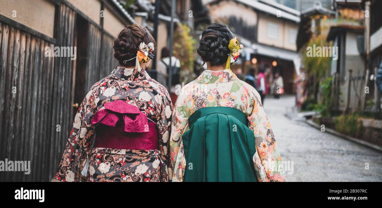Young women wearing traditional Japanese Kimono with colorful maple trees in autumn is famous in autumn color leaves and cherry blossom in spring, Kyo Stock Photo