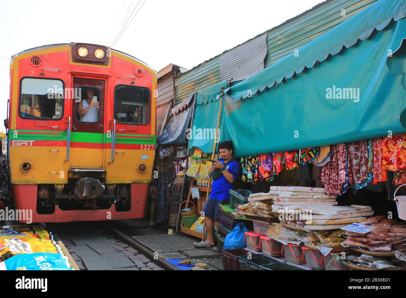 Bangkok/ Thailand -29 December 2019: Mae Klong railway market. one of famous visiting place in bangkok. it build on the railway and the train come the Stock Photo