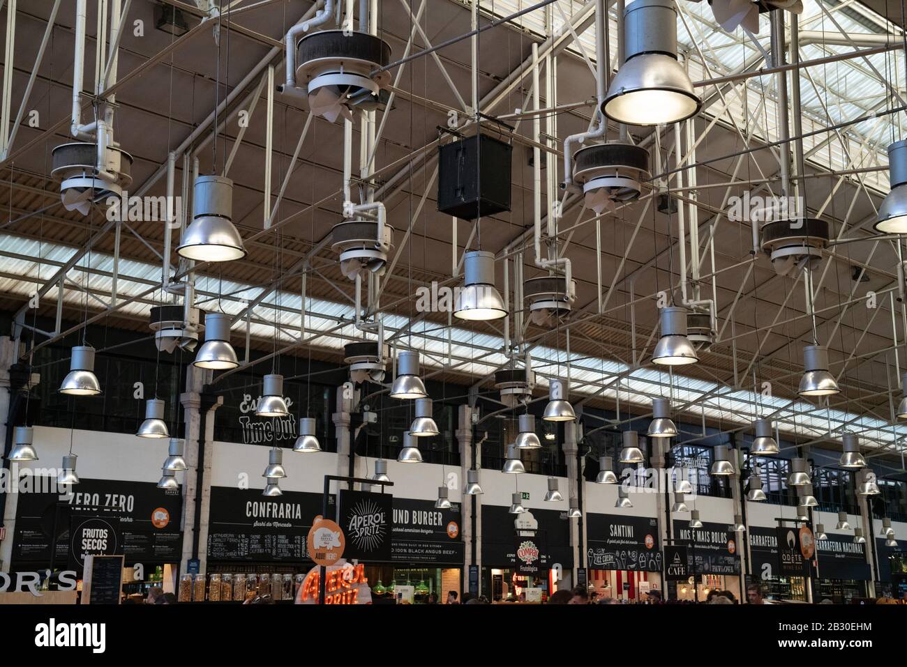 high ceilings and lights at Time Out Market Lisbon Stock Photo