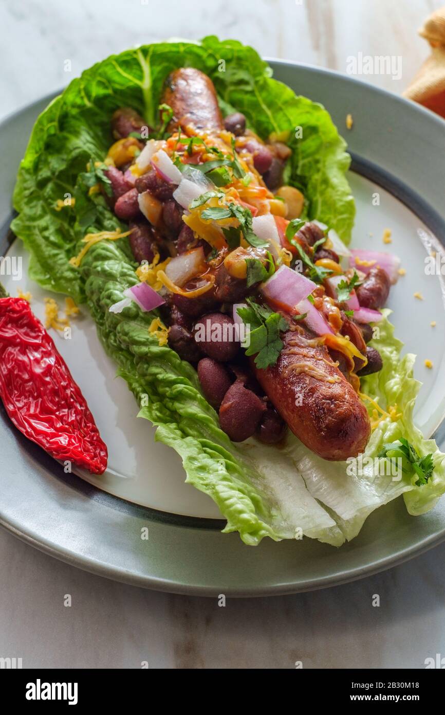 Fancy glutenfree diet nobun chili hot dog lettuce wraps Stock Photo