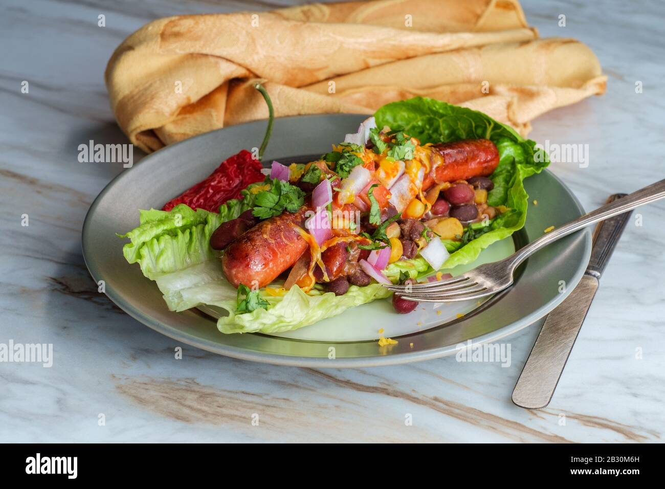 Fancy glutenfree diet nobun chili hot dog lettuce wraps Stock Photo