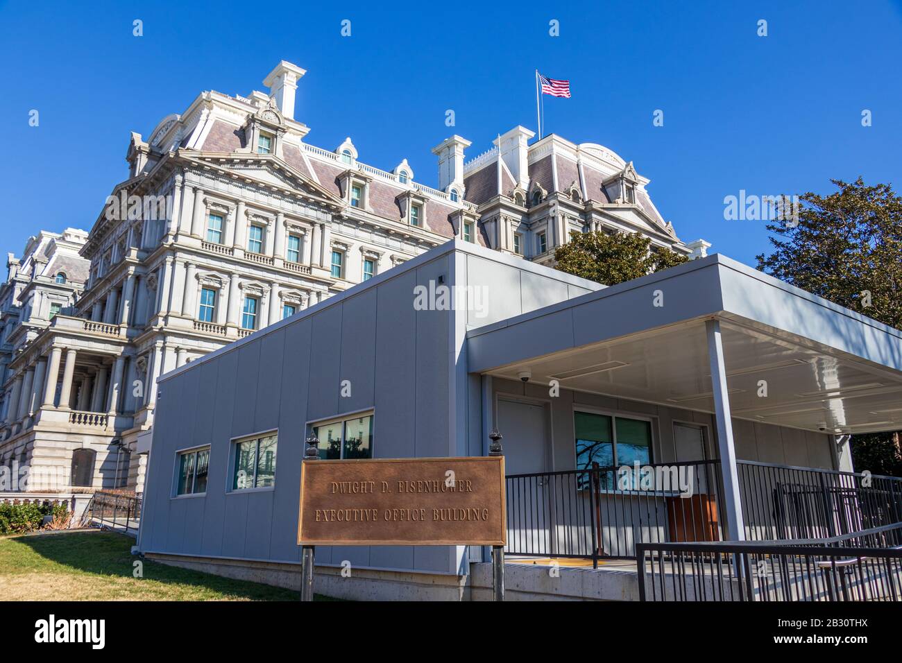 Eisenhower Executive Office Building sign at the front visitor entrance,  building seen in behind on a clear day Stock Photo - Alamy