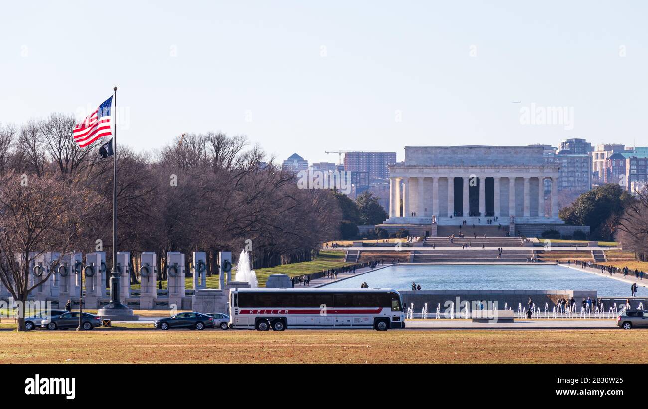 The World War II Memorial in-front of the Lincoln Memorial Reflecting Pool on busy afternoon in Washington. Stock Photo