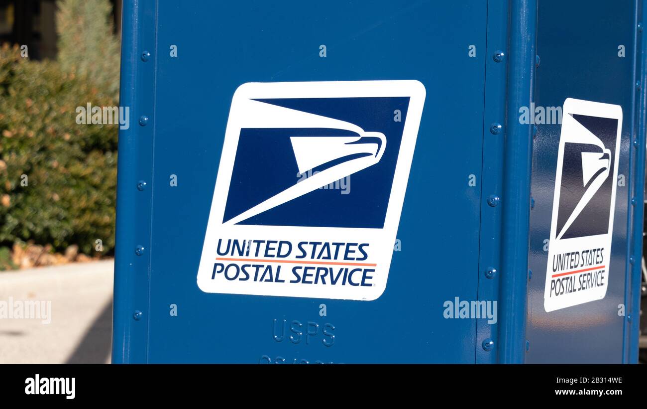United States Postal Service (USPS) logo on the side of a new drop-box. Stock Photo