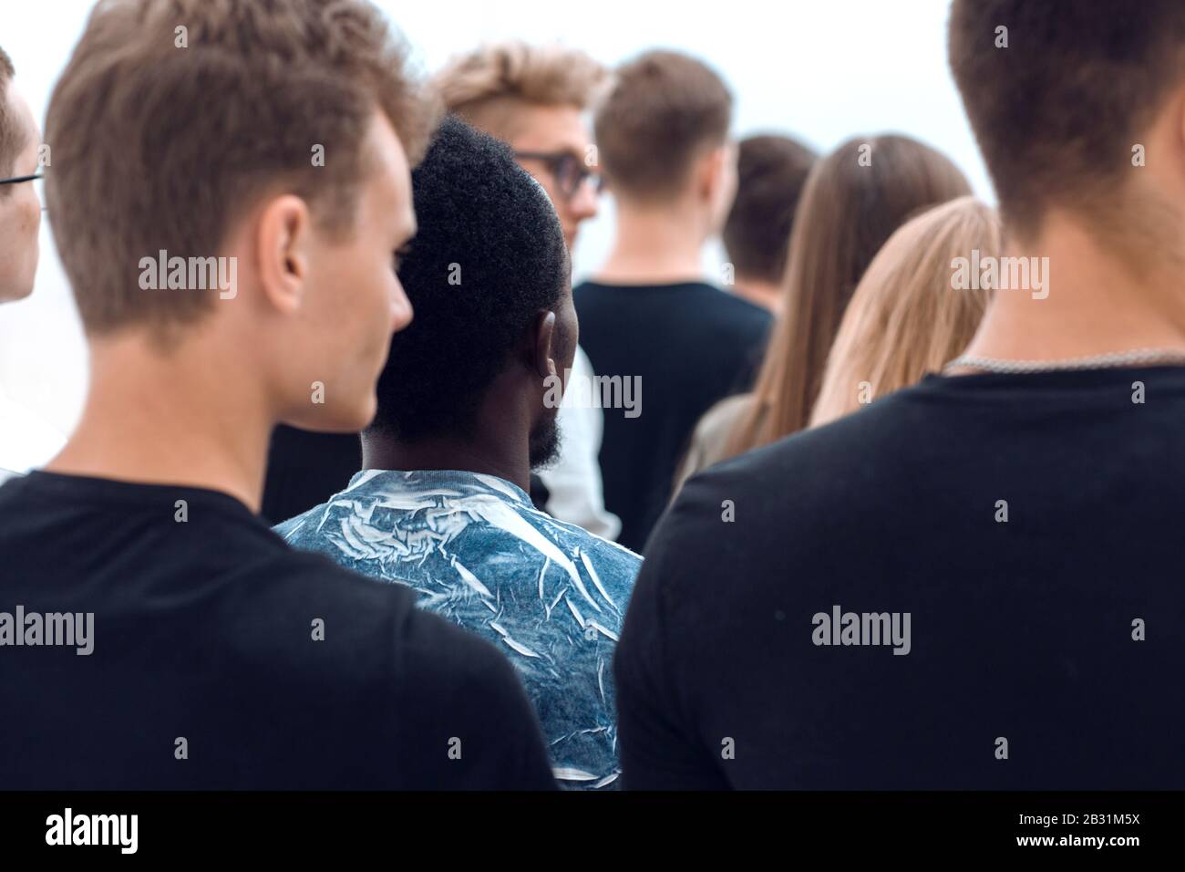 diverse young people built a tower out of their fists Stock Photo