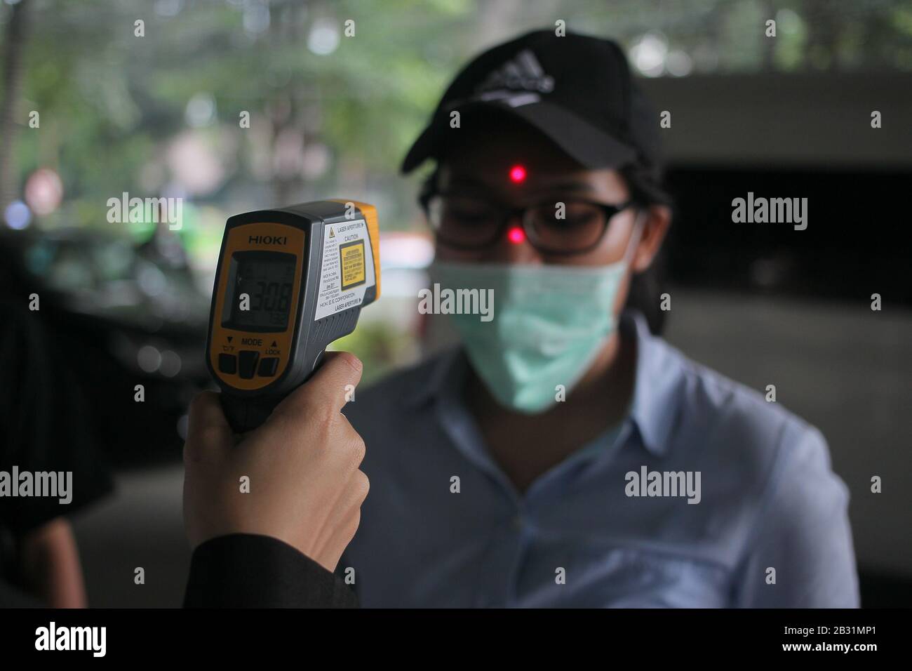 Bogor, Indonesia. 03rd Mar, 2020. A woman is being checked by a thermal gun while at the Hospital in Bogor, West Java, Indonesia, on Tuesday, March 3, 2020. Several hospitals in West Java are ready with medical personnel, treatment rooms, and special equipment for the care of patients infected with the Corona virus (Covid 19). (Photo by Aditya Saputra/INA Photo Agency/Sipa USA) Credit: Sipa USA/Alamy Live News Stock Photo