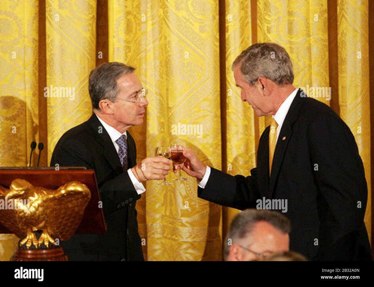 George Bush toast with Alvaro Uribe Velez. Stock Photo