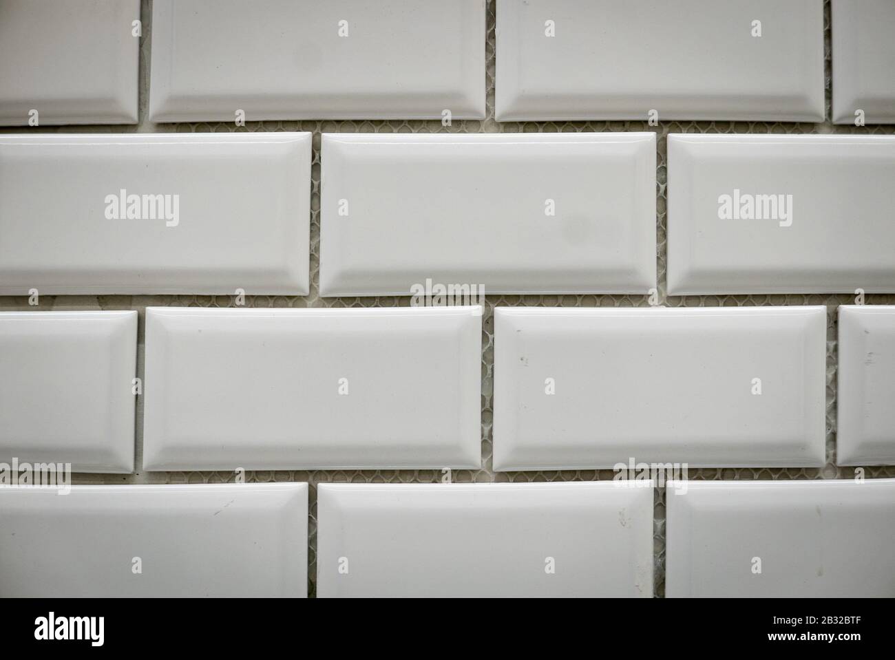 White ceramic bricks on the wall as background. Stock Photo