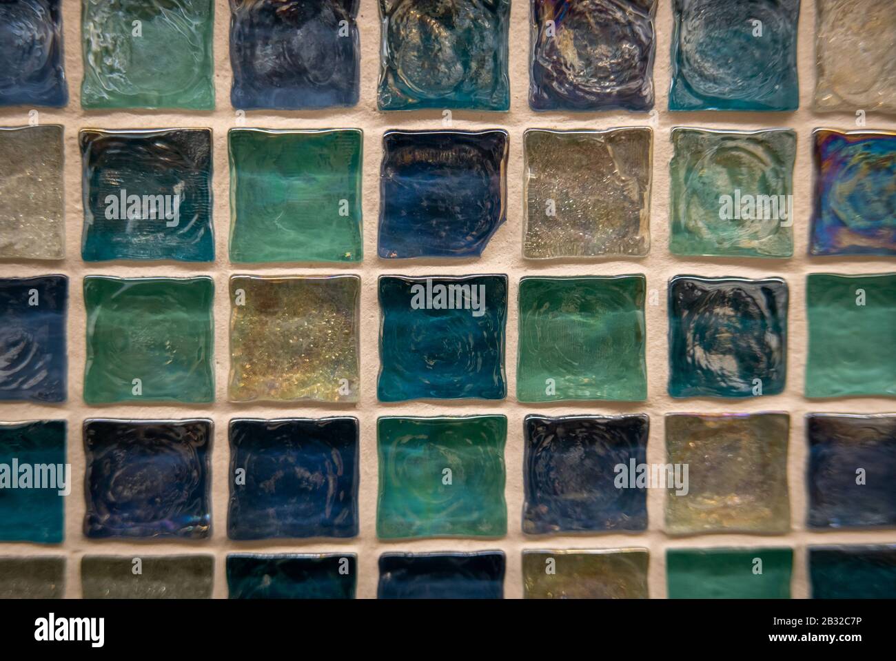 Green ceramic mosaic on the wall as background Stock Photo - Alamy