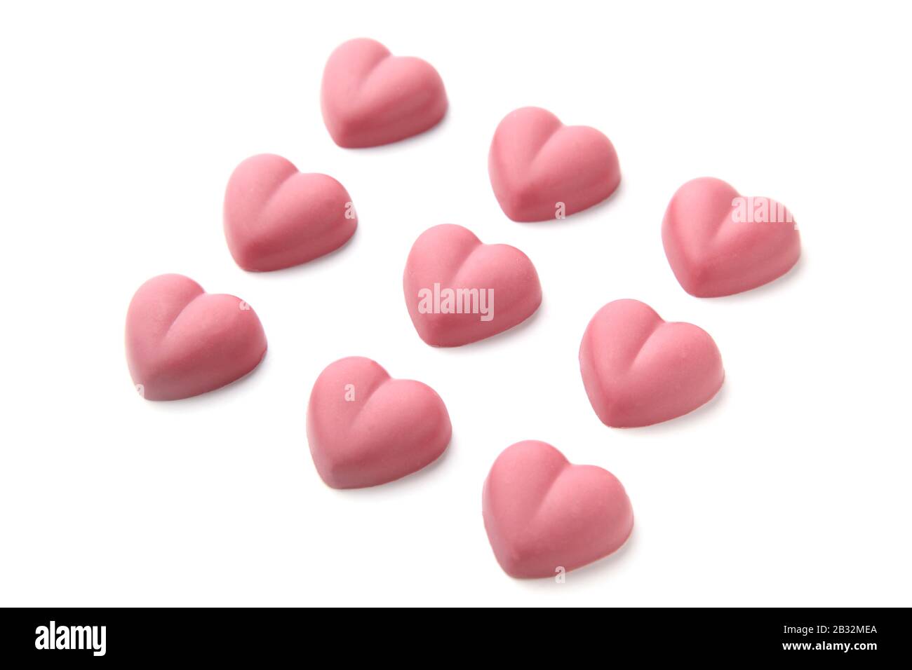 heart shaped pink ruby chocolate closeup isolated on white background Stock Photo