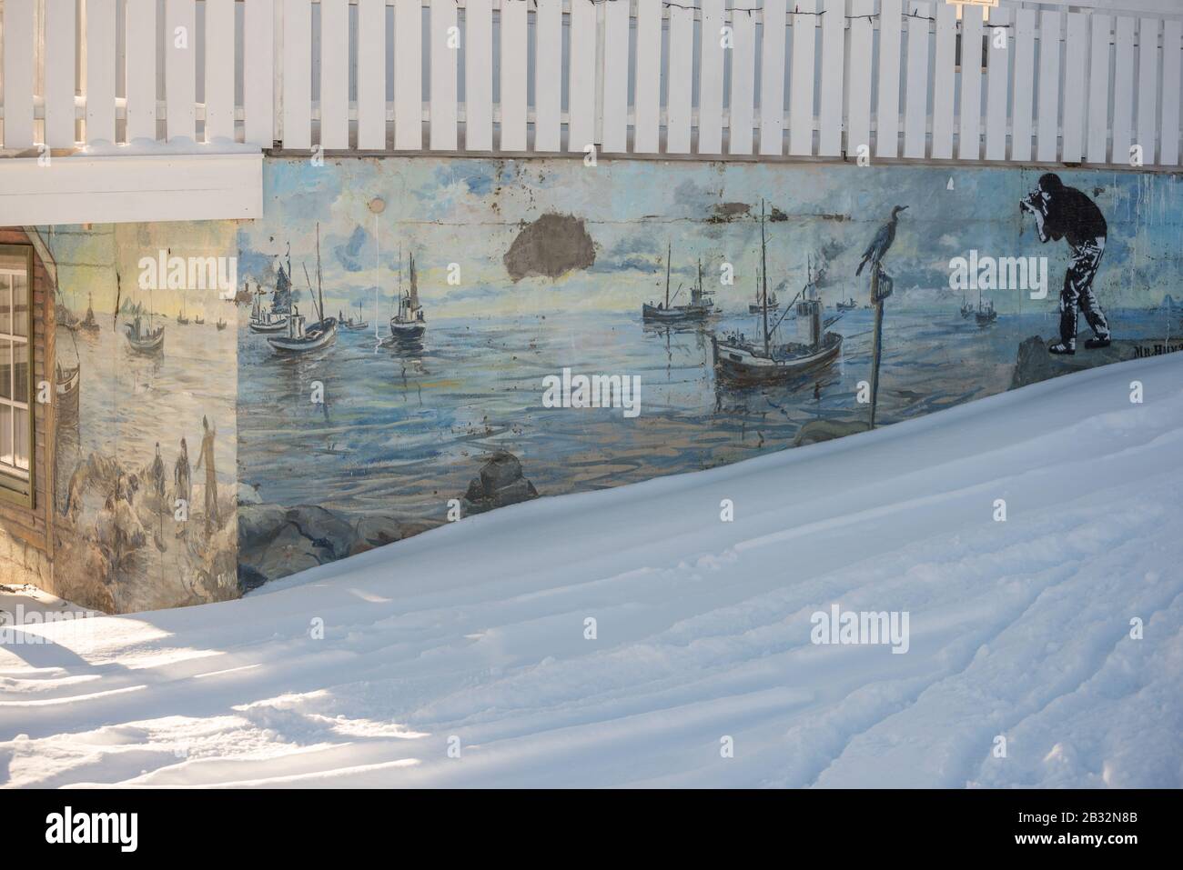 Graffiti of daily life in Lofoten: fishing, boats and photographers. Stock Photo