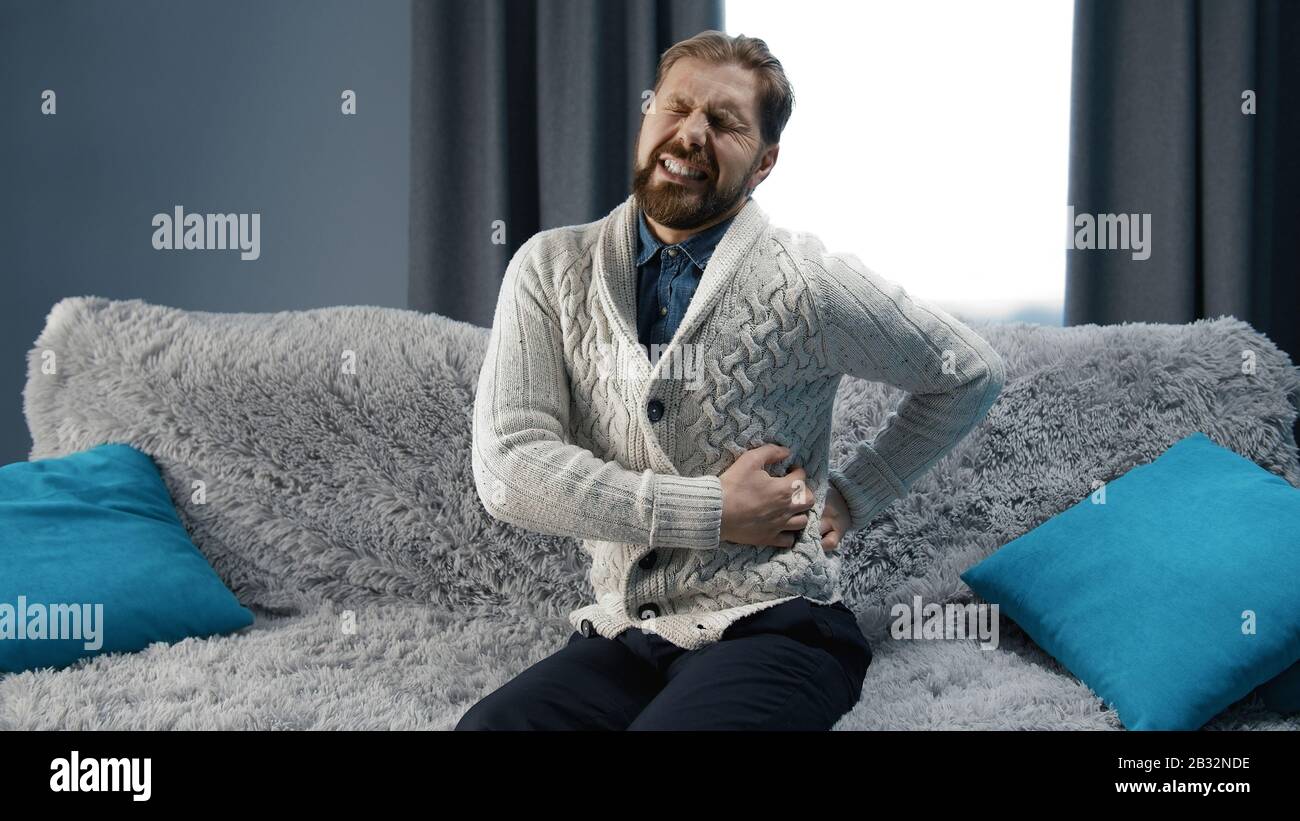 Man suffering from back pain Stock Photo