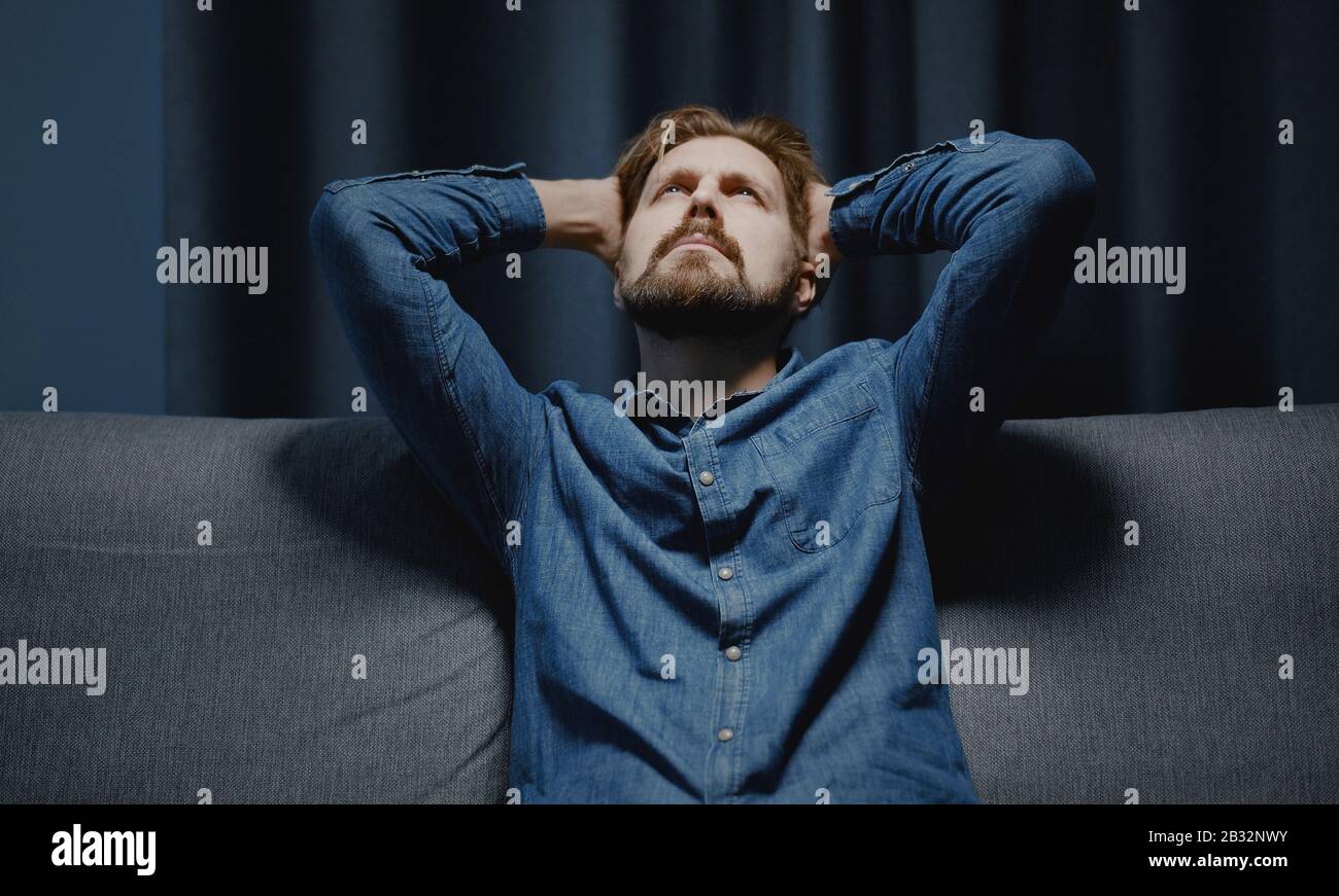 Man holding head looking up Stock Photo Alamy