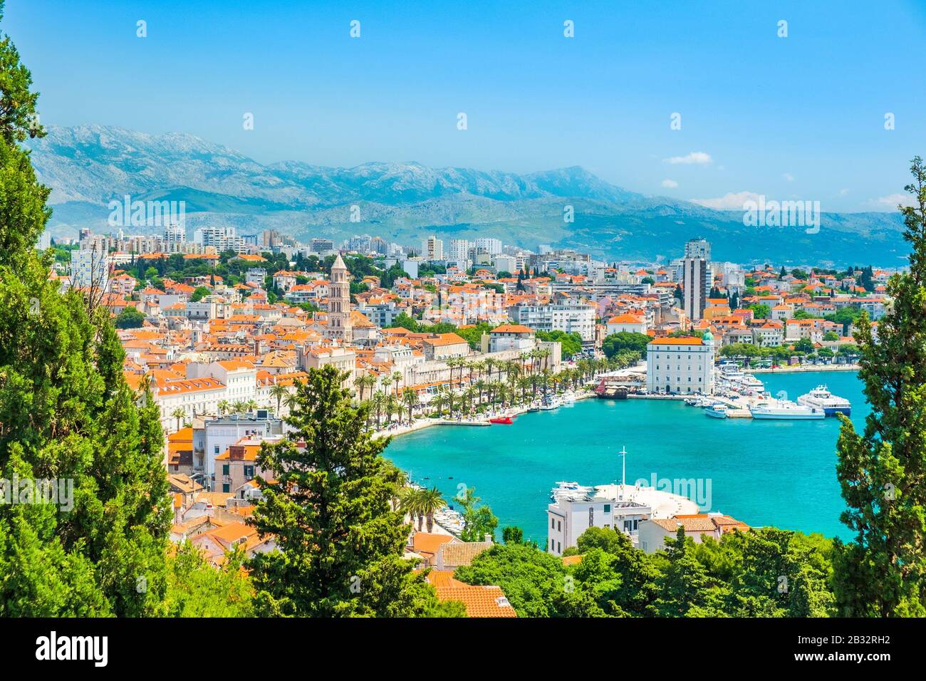 City of Split in Dalmatia, Croatia. City center, palace of Roman emperor Diocletian and cathedral, view through the pine trees. Popular tourist destin Stock Photo