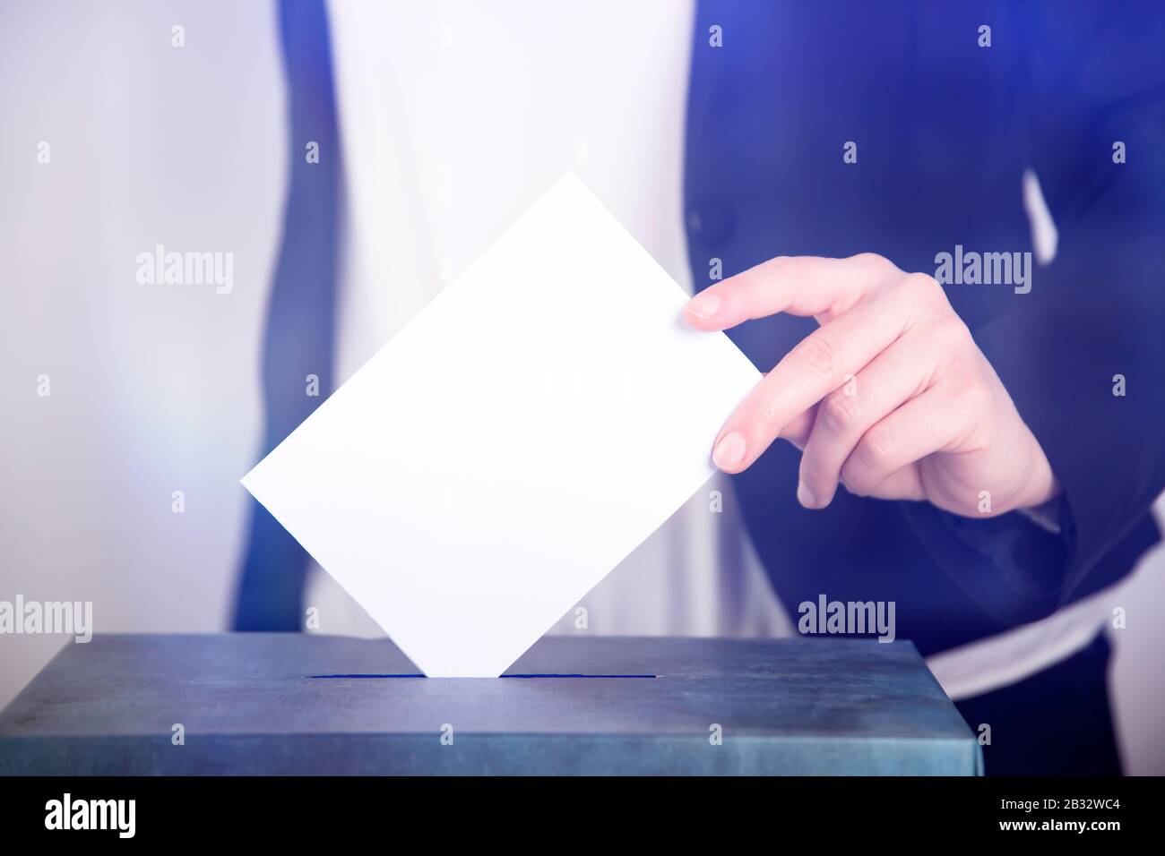 Hand Of A Voter Putting Vote In The Ballot Box Election Concept Stock