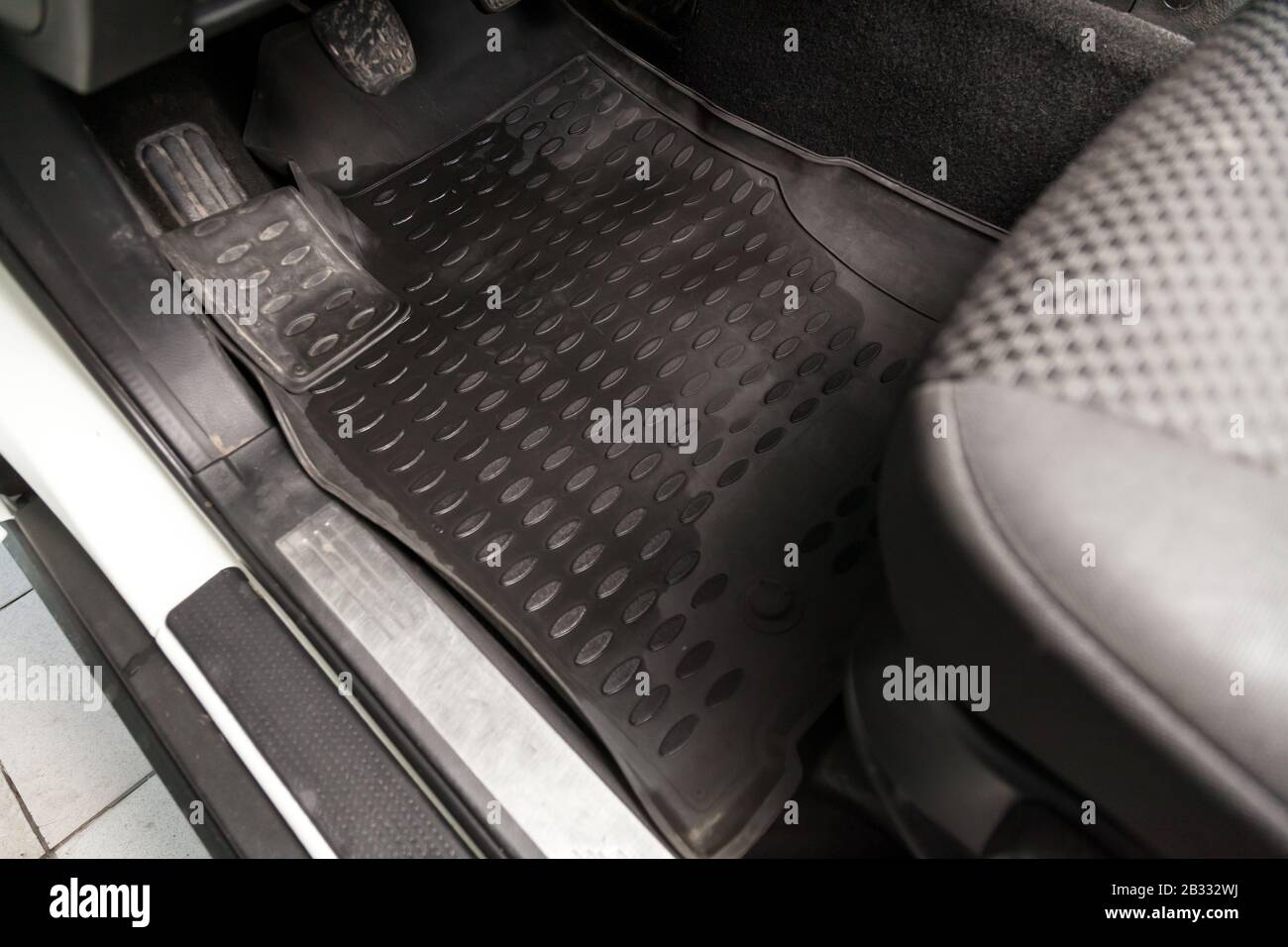 Sar Floor Mats Of Black Rubber With Gas Pedals And Brakes In The
