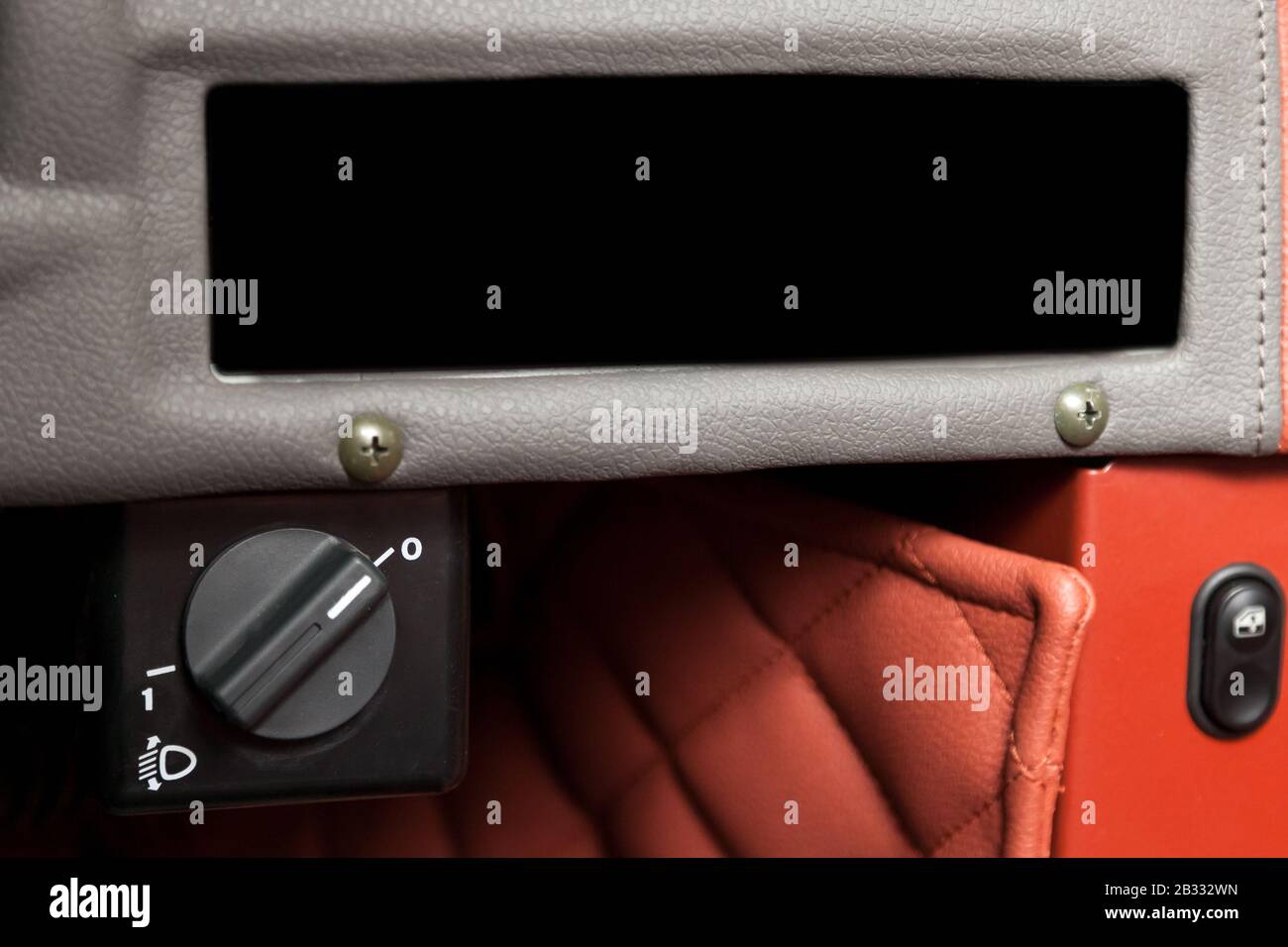 Black button switch for turning electric headlight range adjustment of