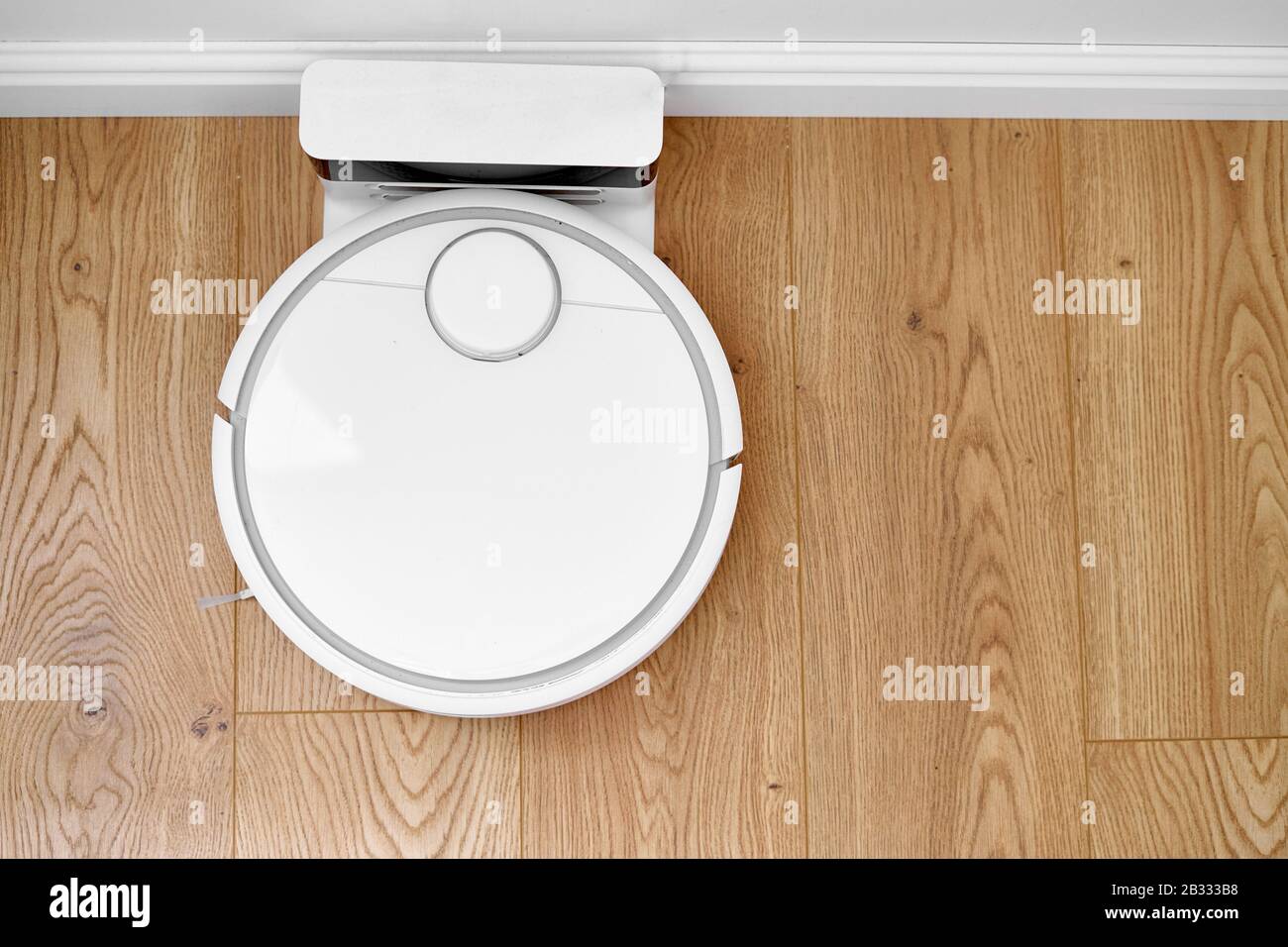 Smart Home Concept Charging Automatic Robot Vacuum Cleaner Stock