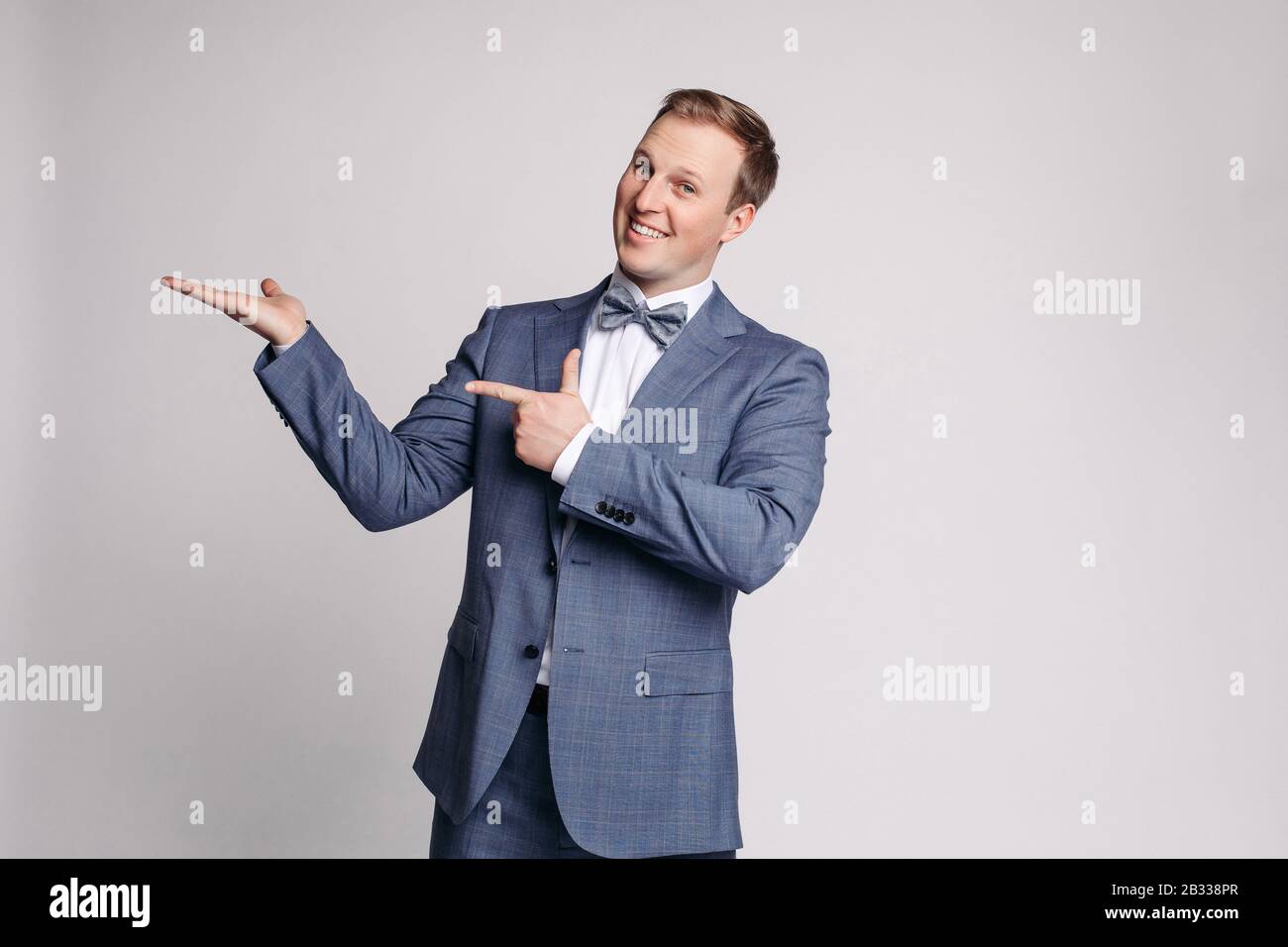 Portrait of handsome man in black suit Stock Photo - Alamy