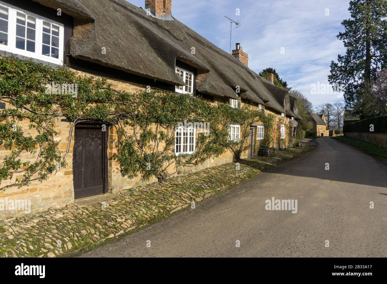 Row of thatched terraced cottages in the picturesque hamlet of