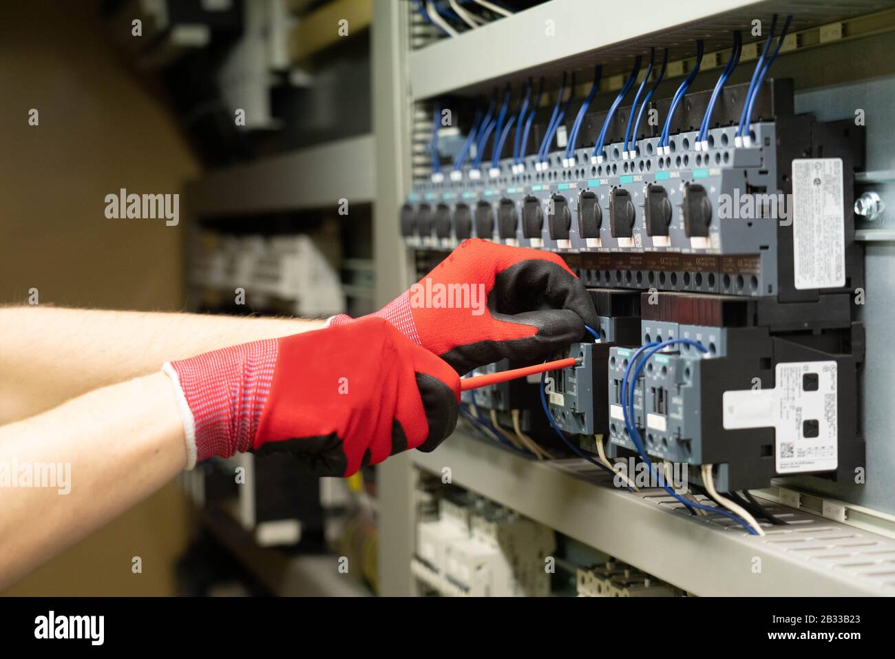 Electrician doing an installation Stock Photo