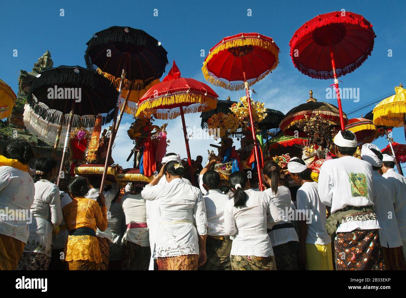 Balinese woman wearing traditional costume, sarong ,during ceremony in