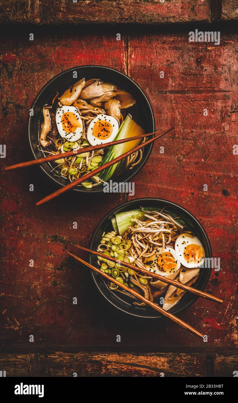 Japanese Ramen bowls with chicken meat and shiitake mushrooms Stock