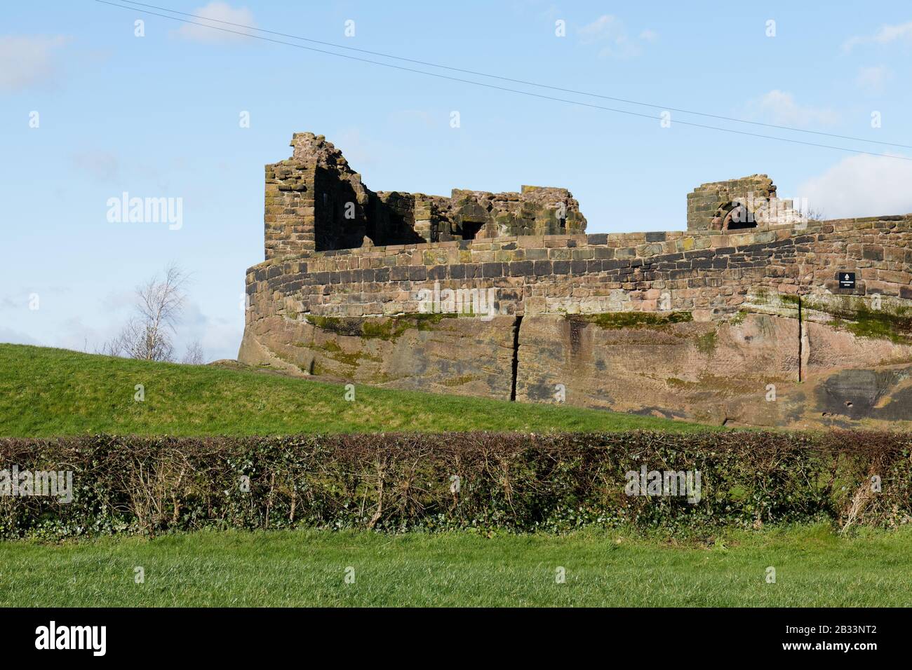 The ruins of Halton Castle in Runcorn in Cheshire, England are built on a sandstone outcrop, with views of Runcorn, Widnes and the surrounding area Stock Photo