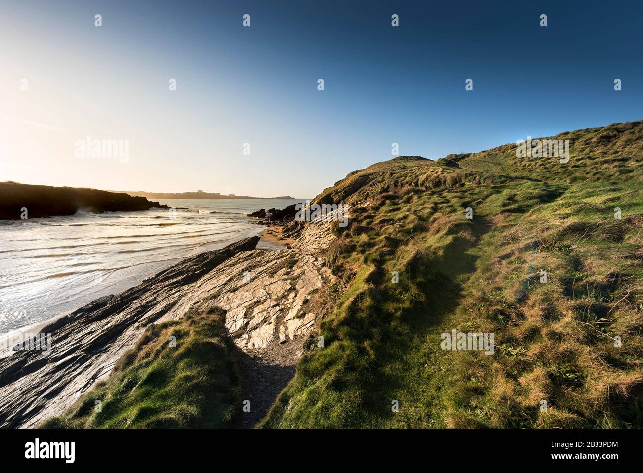 A rough footpath leading up to the summit of Porth Island Trevelgue Head in Newquay in Cornwall. Stock Photo