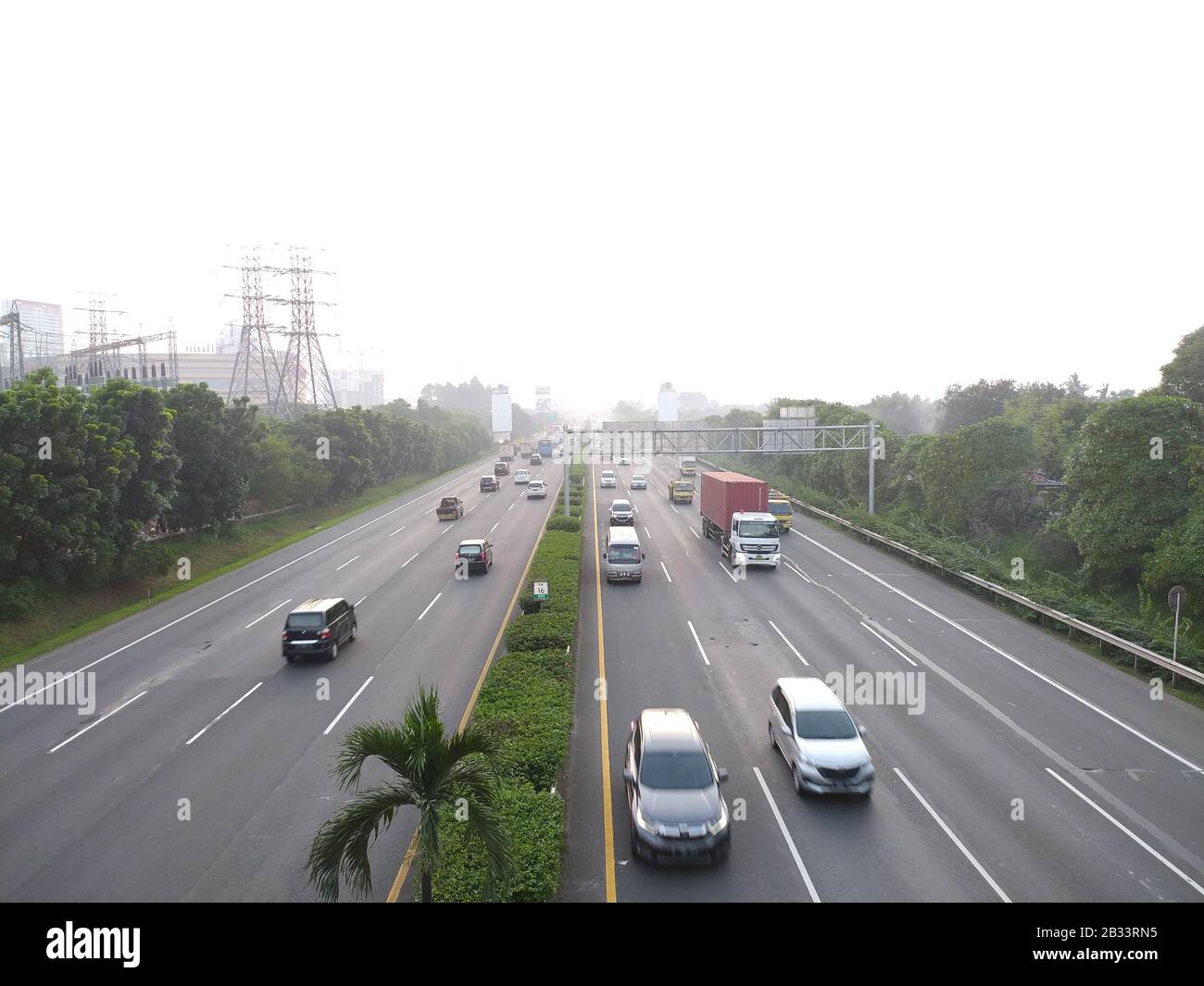 middle of highway road with busy traffic on afternoon with beautiful