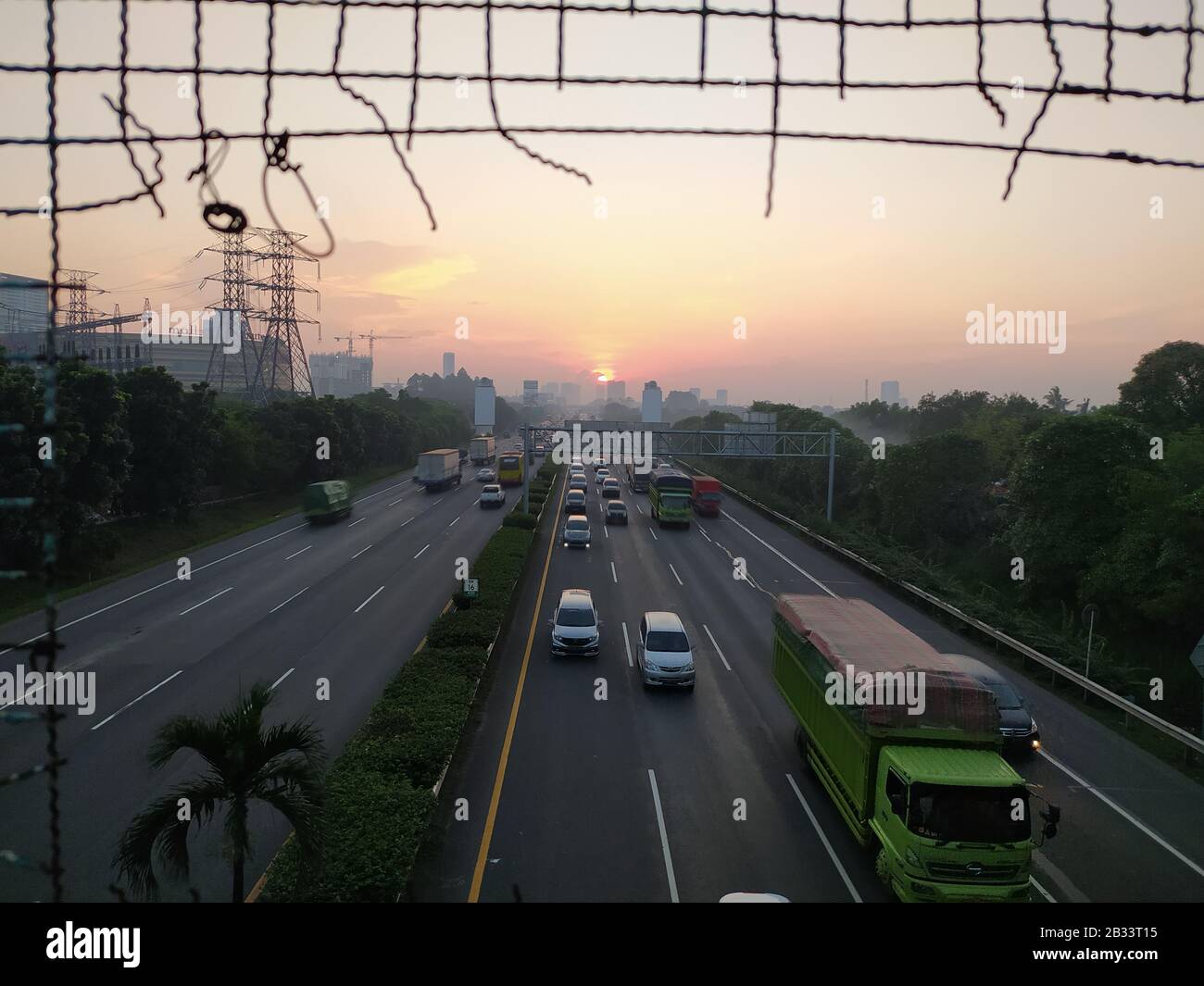 middle of highway road with busy traffic on afternoon with beautiful