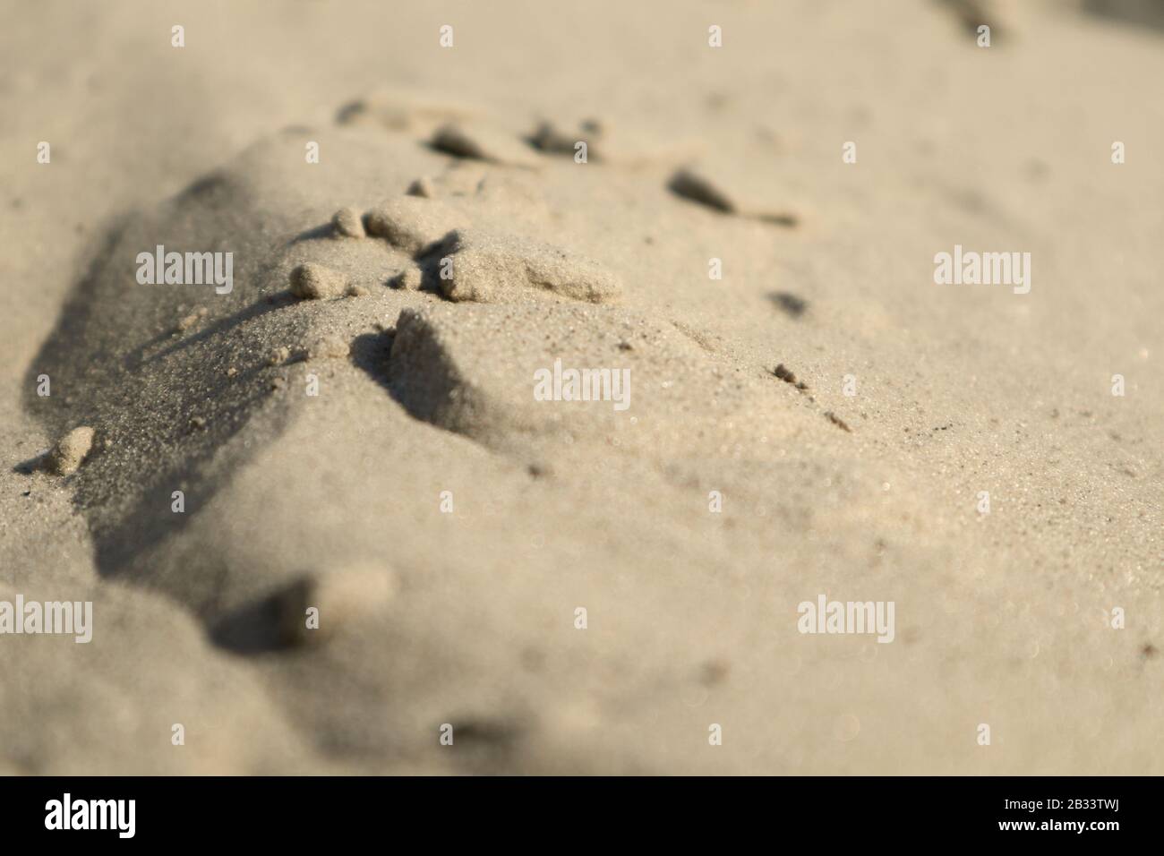 Sand dunes close-up macro nature. White and yellow sand natural texture background Stock Photo